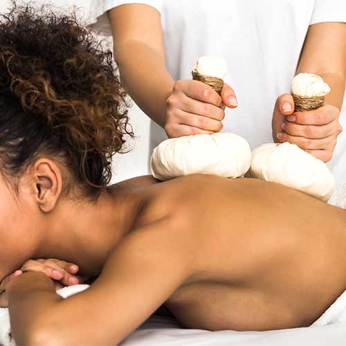 Kräuterstempel-Massage